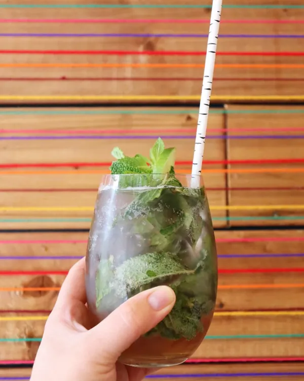 Fresh mint cocktail against a colourful striped Peruvian backdrop